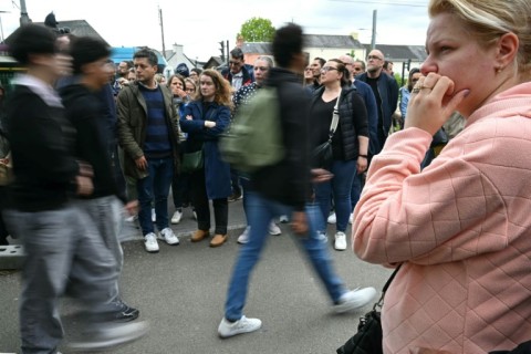 Concerned parents gathered outside of the Notre-Dame de Toutes-Aides secondary school after the attack