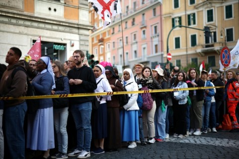 As the first rays of the day rose over the sprawling Baroque plaza, mourners rushed towards empty chairs