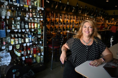 Karen Miner, who owns a wine shop in Reno, Nevada, seems unconcerned with how Trump's tariffs could impact her stock