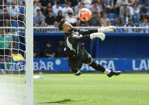 Alaves goalkeeper Antonio Sivera made a fine save to deny Atletico's Clement Lenglet