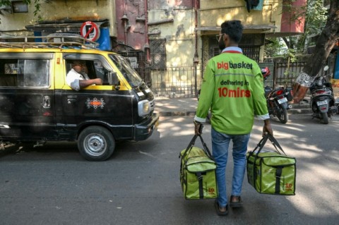Armies of 'dabbawalas' crisscross Mumbai by foot and bicycle, delivering food to office workers who are keen to avoid the searing heat and traffic