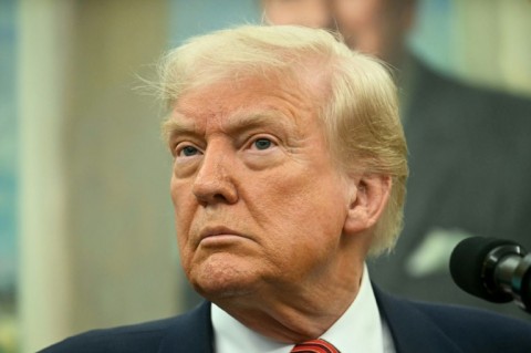 British Prime Minister Keir Starmer handed US President Donald Trump a letter from King Charles III during a meeting in February