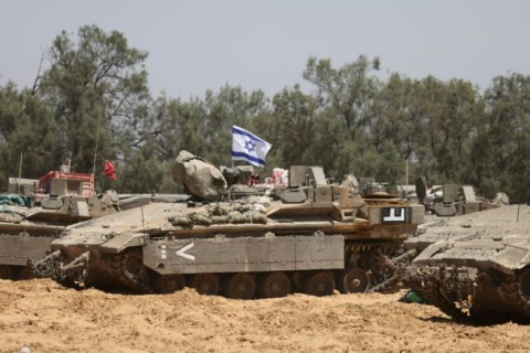 Israeli troops deploy at a position near the southern Israeli border with the Gaza Strip, on May 8, 2025