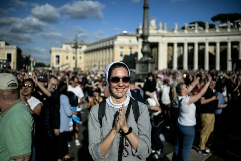 Pilgrims and onlookers cheered when the white smoke appeared
