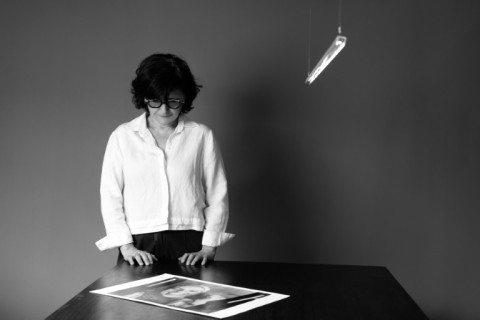 Sepideh Farsi with a portrait of Palestinian photographer Fatima Hassouna, who was killed by the Israeli army