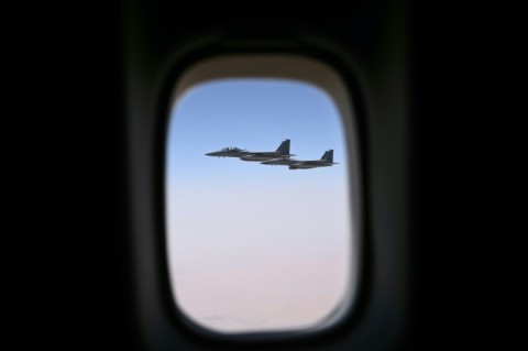 A Saudi fighter jet is seen escorting Air Force One as it approaches Riyadh
