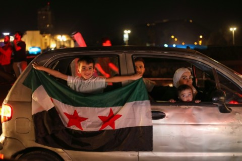 Syrians celebrate President Donald Trump's announcement that he will lift US sanctions on the war-battered country.