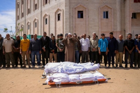 Mourners pray for the dead after Israeli strikes in Gaza
