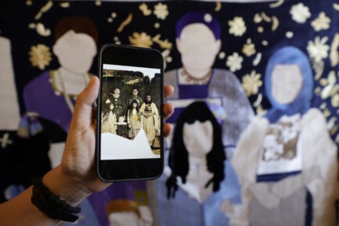 An old photograph being used as the basis for one artwork