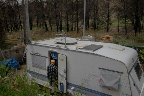 Some residents were left living in caravans after last year's fires destroyed their homes