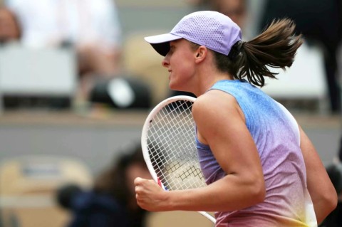 Poland's Iga Swiatek celebrates her first-round victory over Slovakia’s Rebecca Sramkova