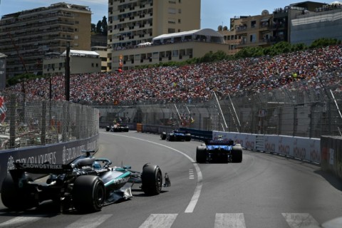 Traffic jam: Mercedes driver George Russell (L) grew frustrated when he was stuck behind the the slow-moving Williams cars on Sunday