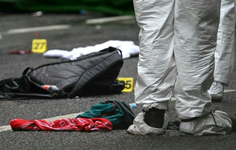Police forensics officers on Water Street in Liverpool a day after the car ploughed into celebrating crowds