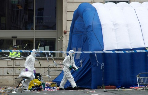 A police tent covers the car that slammed into the Liverpool crowds