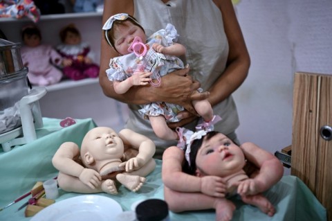 The 'reborn' baby market was launched by artists who customized dolls to make them look more life-like and has developed into a multi-million-dollar global market