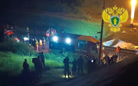 At least seven people were killed late Saturday and dozens injured after a bridge collapsed onto a railway in a Russian region bordering Ukraine, officials said