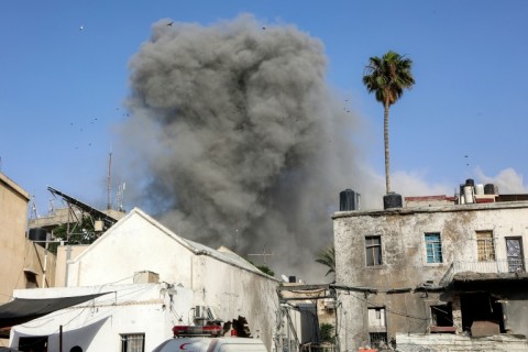 A cloud of smoke rises after Israeli bombardment on a building in the Daraj neighbourhood of Gaza City