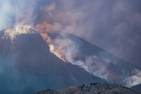 Smoke rises from the crater of Mount Etna