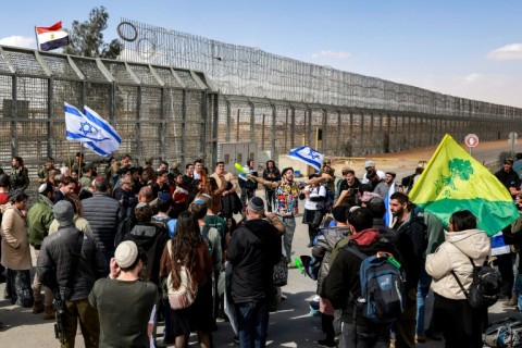 Israeli demonstrators gather at the Nitzana crossing on January 30, 2024, to block humanitarian aid reaching besieged Gaza