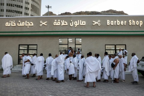 In Mecca, entire streets are lined with barbershops doing brisk business