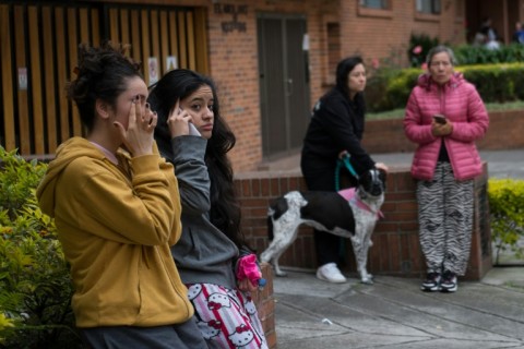 Residents of the Pasadena neighborhood remain on the street after an earthquake in Bogota on June 8, 2025 sent people rushing out of their homes