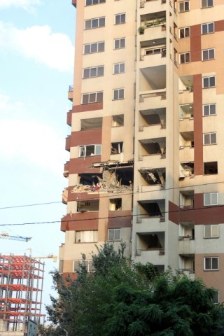 An AFP photo shows a gaping hole in the side of a Tehran high-rise building on June 13, 2025