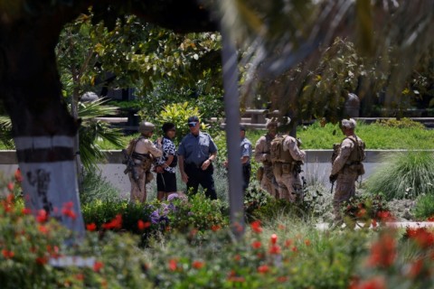 A man is detained by US Marines and members of the National Guard at the Wilshire Federal Building in Los Angeles, California, on June 13, 2025 -- an exceedingly rare example of federal troops detaining a US civilian
