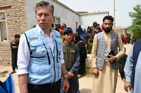 UN Emergency Relief Coordinator Tom Fletcher (L) visiting a mobile healthcare centre in Afghanistan's Kunduz Province in April