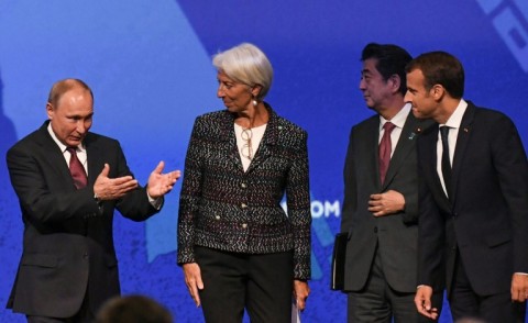 France's Emmanuel Macron and Japan's Shinzo Abe sat on stage alongside Putin at SPIEF in 2018