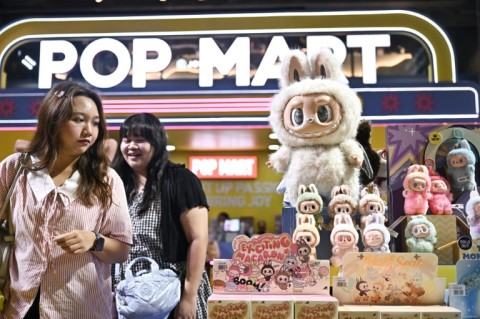 Shoppers browse for Labubu dolls at a Pop Mart pop-up store in in Bangkok