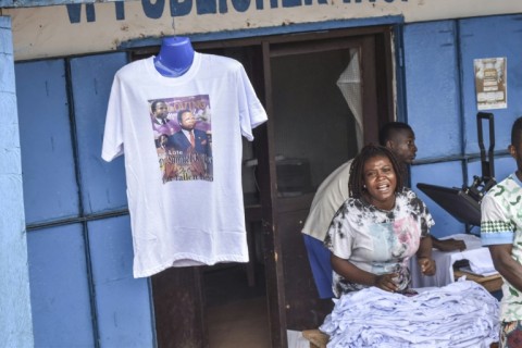 T-shirts with a portrait of former Liberian president Samuel Doe were on sale as the country held a funeral for him, 35 years after he was tortured and killed