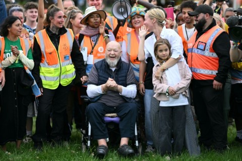 'People that don't like the politics of the event can go somewhere else,' says Glastonbury co-founder Michael Eavis (centre)