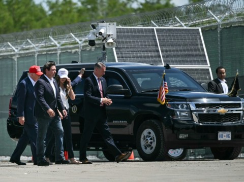 (L/R) US President President Donald Trump, Florida Governor Ron DeSantis, and Secretary of Homeland Security Kristi Noem visit a migrant detention center, dubbed "Alligator Alcatraz," in Ochopee, Florida on July 1, 2025