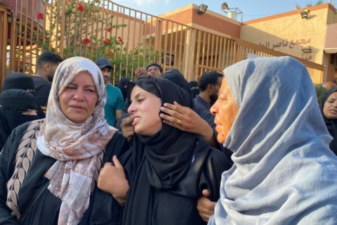 People gathered at Khan Yunis's Nasser Hospital to mourn those killed in an Israeli strike