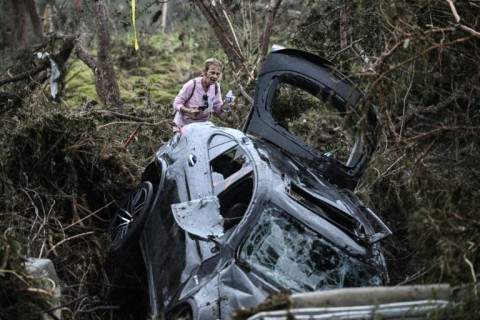 A search and rescue team looks for people along the Guadalupe River near Camp Mystic in Hunt, Texas