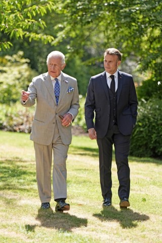 French President Emmanuel Macron discussed biodiversity issues with the king during a stroll in the castle grounds