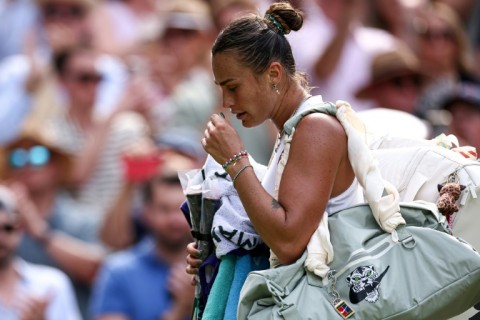 Top seed Aryna Sabalenka leaves Wimbledon's Centre Court after her defeat by US 13th seed Amanda Anisimova