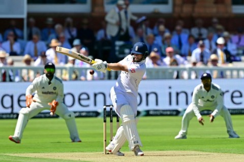 India's Nitish Kumar Reddy (L) celebrates after dismissing Ben Duckett in the third Test against England at Lord's