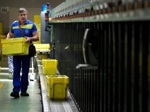 A decidcated sorting area in the technical area of Rome's Fiumicino Airport allows Italian postal workers to handle the pope's huge letterbox