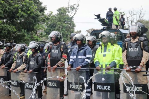 Riot police stood guard during the protest