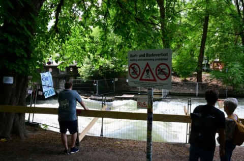 A sign reading 'Surfing and swimming prohibited' before the closure was lifted