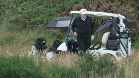 US President Donald Trump plays golf at his Turnberry resort in Scotland