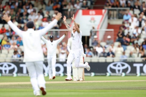 England captain Ben Stokes (C) celebrates with team-mates after dismissing India's KL Rahul in the fourth Test at Old Trafford