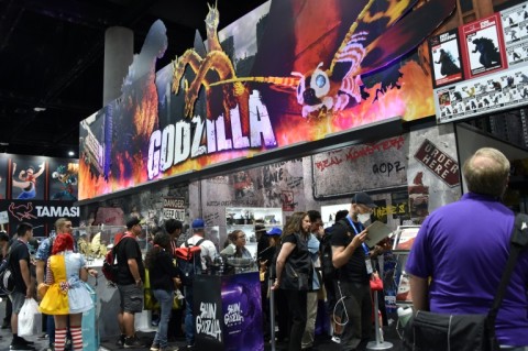 People throng a "Godzilla" display at Comic-Con