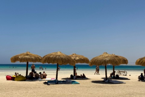 Tourists gather at the beach at Ras Hankorab on the Red Sea in southern Egypt