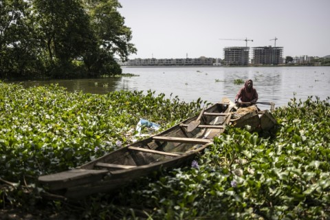 Sat in his pirogue on Jabi lake in Abuja this local fisherman, like his peers, has a mixed relationship with the city
