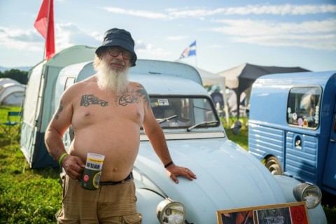 Gabriele Salvoni, from Italy, poses with his 2CV