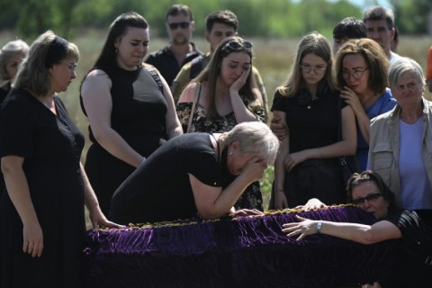 The funeral for Mykyta and Sofia Lamekhov and their son Lev in Sloviansk, Ukraine, on August 5