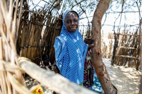 A young Chadian poses for a photograph at the Kiskra site for internally displaced people