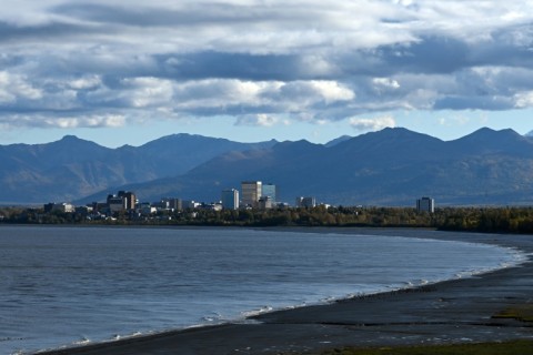 The Chugach Mountains and Alaska's biggest city Anchorage seen from across the waters of the Knik Arm